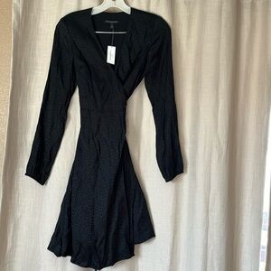 Beautiful wrap around black dress. Leopard print